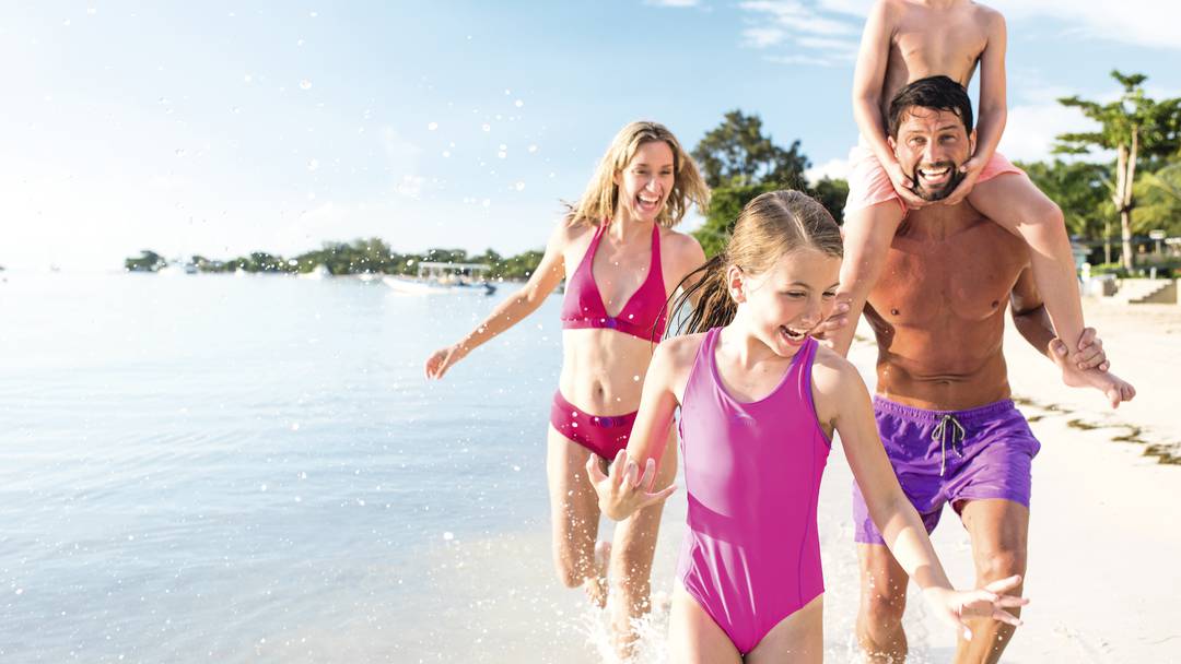 family having a great time along the beach during an original orlando tours beach visit