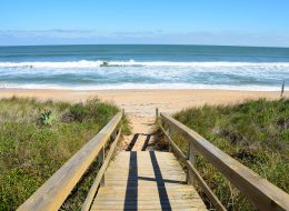 this walkway leads to the sun and sand of one of florida's most beautiful beaches experienced during an original orlando tours visit to the cape canaveral beach